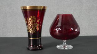 A gilded Ruby glass vase along with a large ruby glass brandy goblet. H.23 Diam.14cm