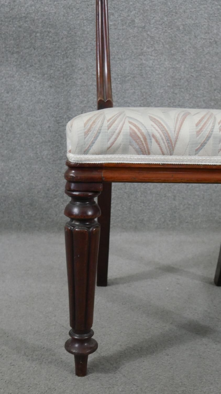 A set of six mahogany dining chairs, circa 1840, with bar backs, on carved reeded supports, over - Image 6 of 7