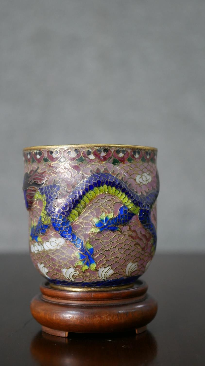 A Chinese Plique a Jour enamel cup decorated with dragons and flaming pearl. H.8 Diam.7.5cm