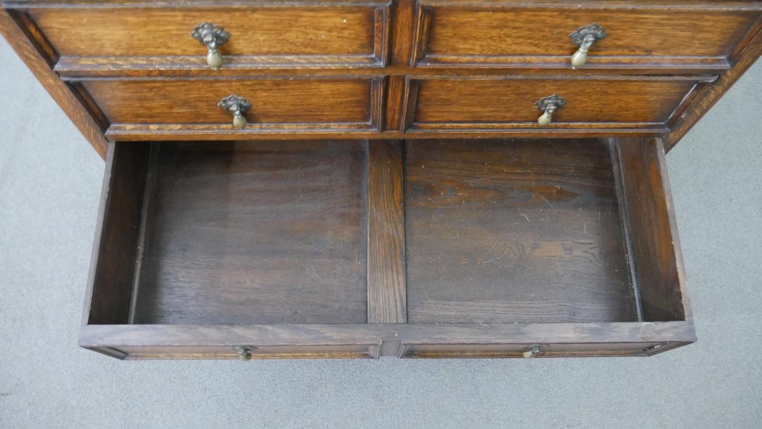 An early 20th century antique style oak chest of drawers, with a gallery back over four long - Image 6 of 7