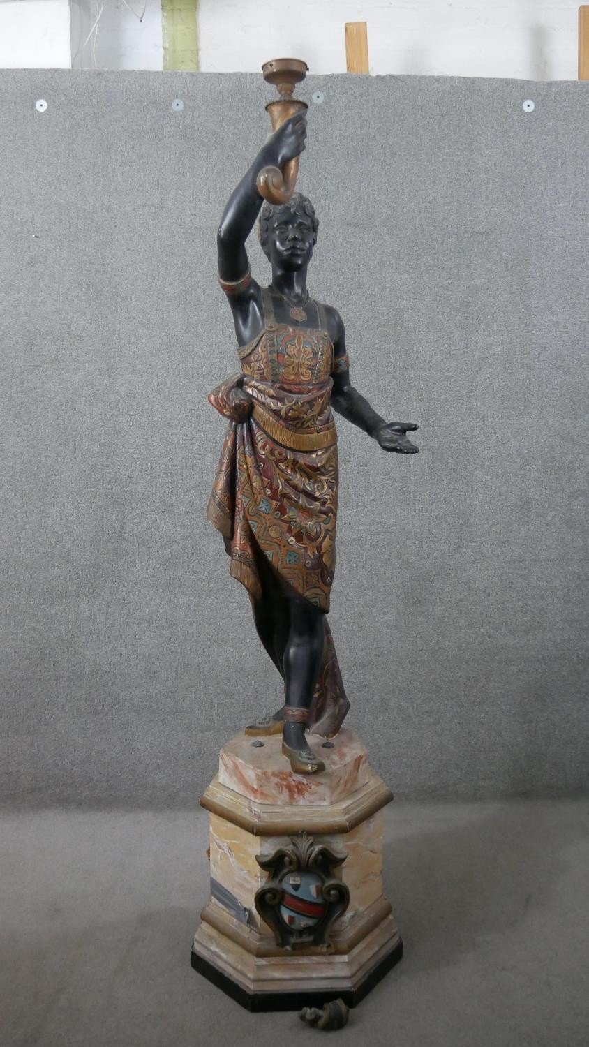 A 20th Century Italian style blackamore figure, formerly a candelabrum.