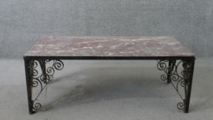 A vintage rectangular rouge marble topped coffee table, on an iron frame with scrolling wrought iron