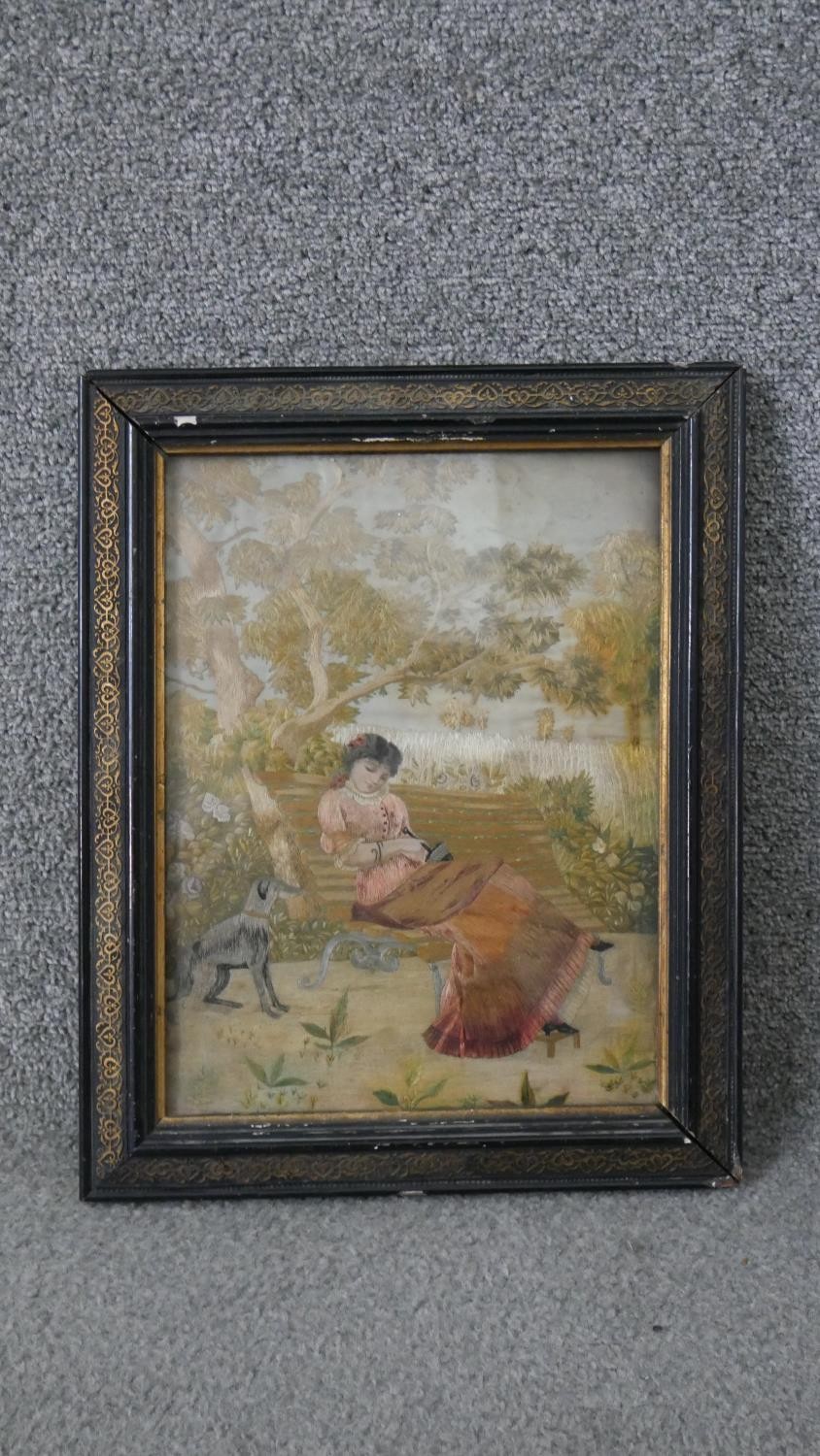 A framed and glazed 19th century Italian silk work embroidery of a lady sitting on a bench with - Image 2 of 4