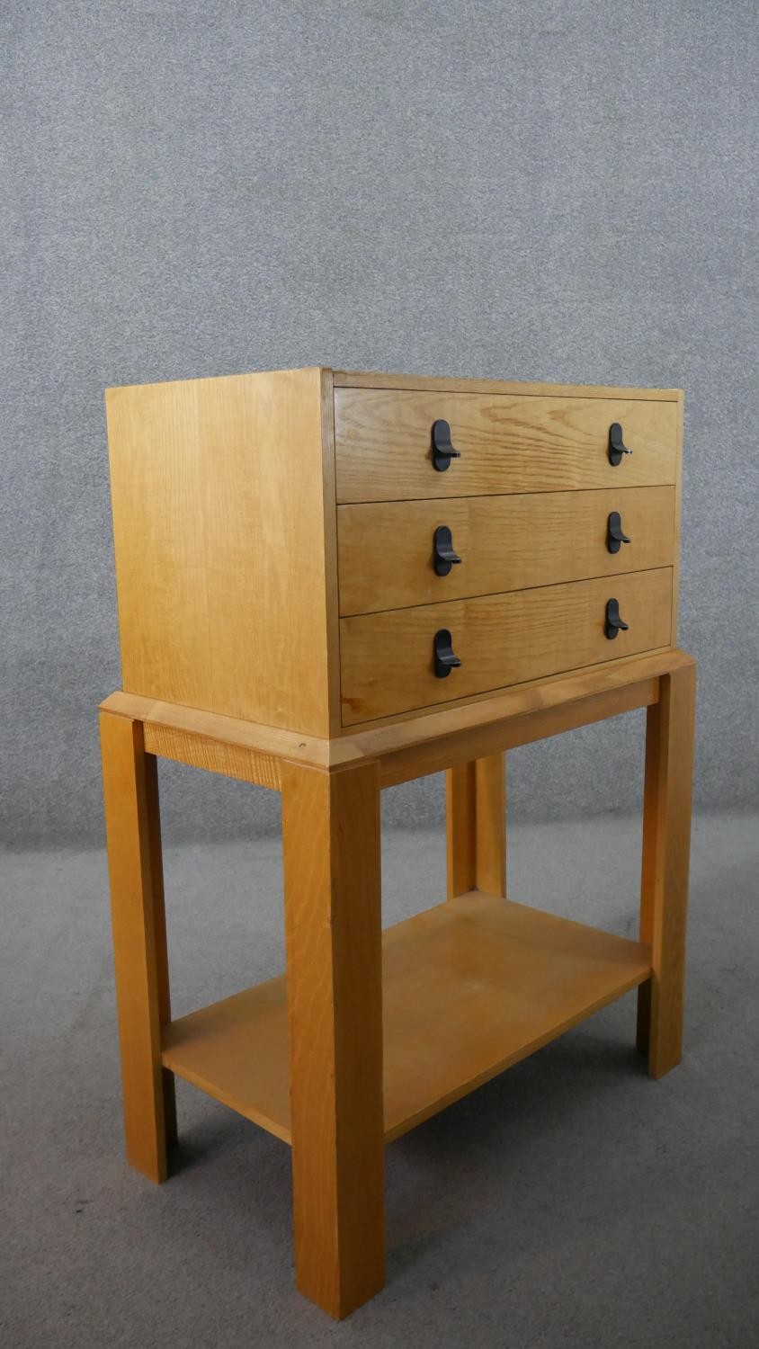 A 20th century ash chest on stand, with three long drawers over bracket legs, joined by an - Image 5 of 5