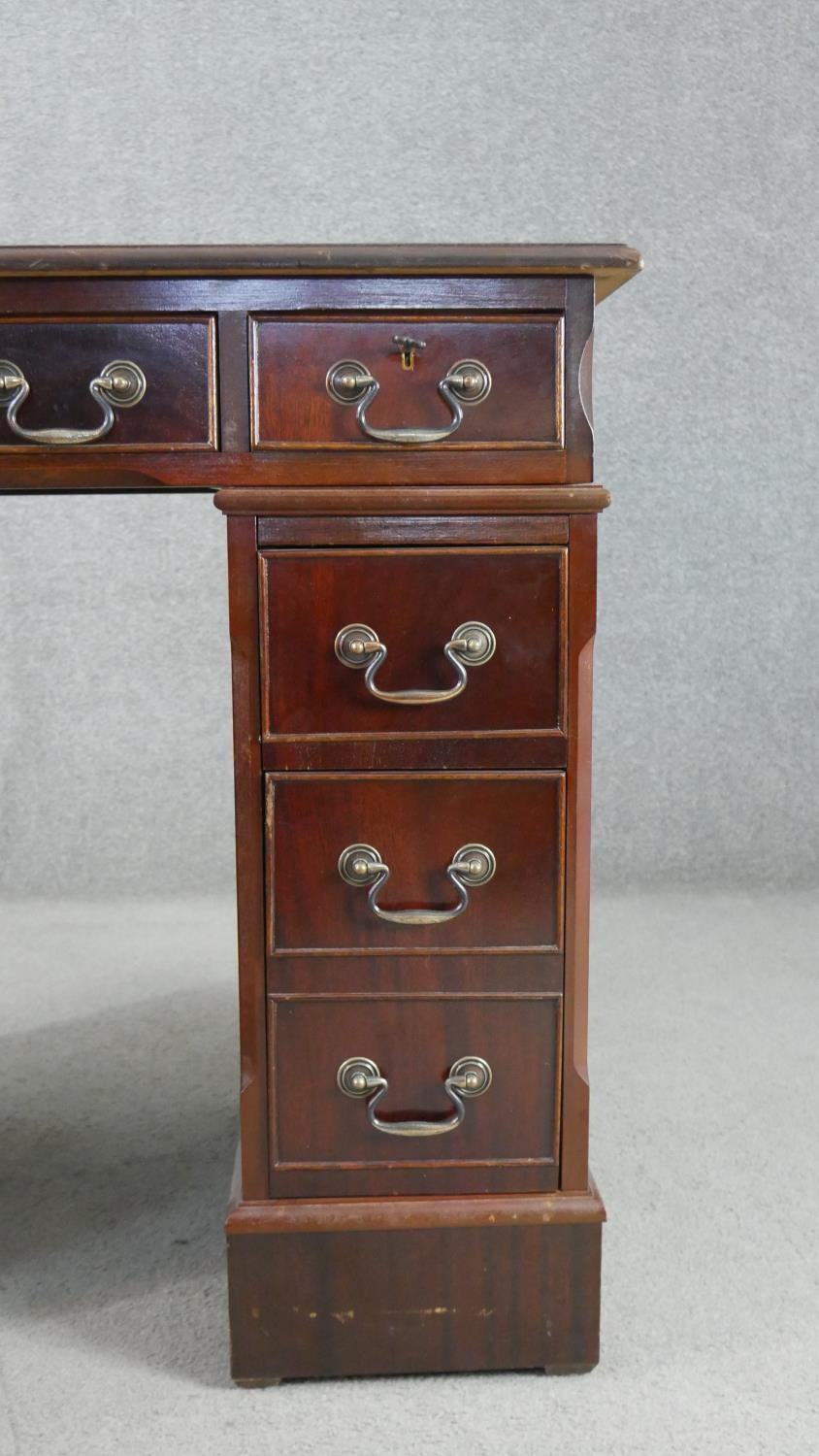 A 19th century style mahogany pedestal desk, of small proportions, with a tooled green leather - Image 6 of 8