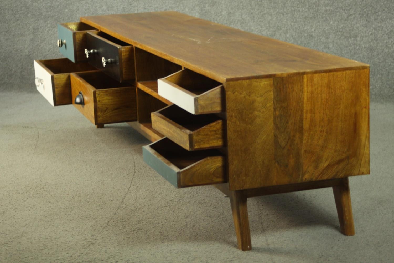 A contemporary mango wood sideboard or media cabinet, with an arrangement of seven drawers, some - Image 10 of 12