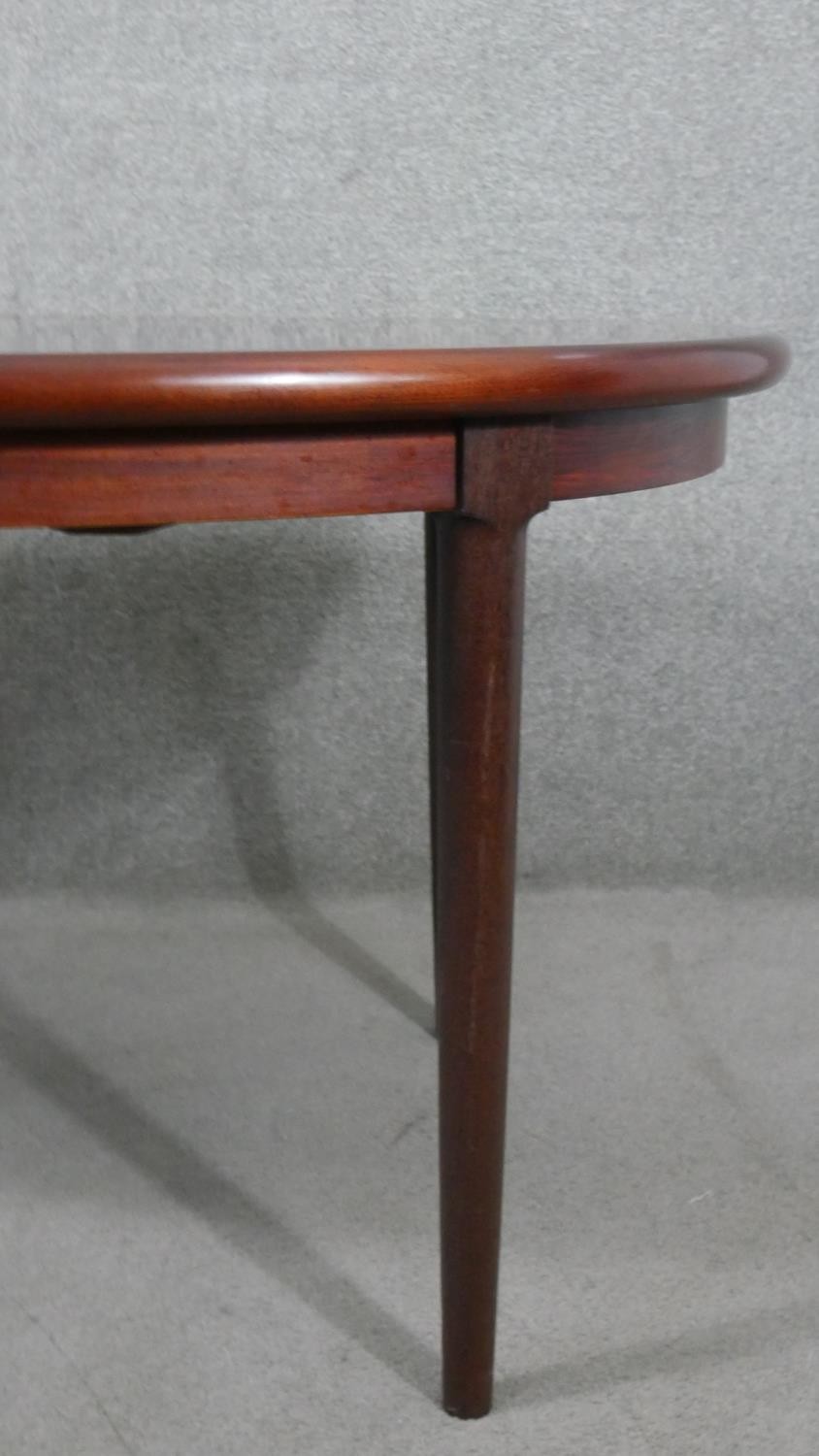 A vintage extending dining table with two extra leaves on tapering shaped supports. H.70 W.260 W. - Image 2 of 6