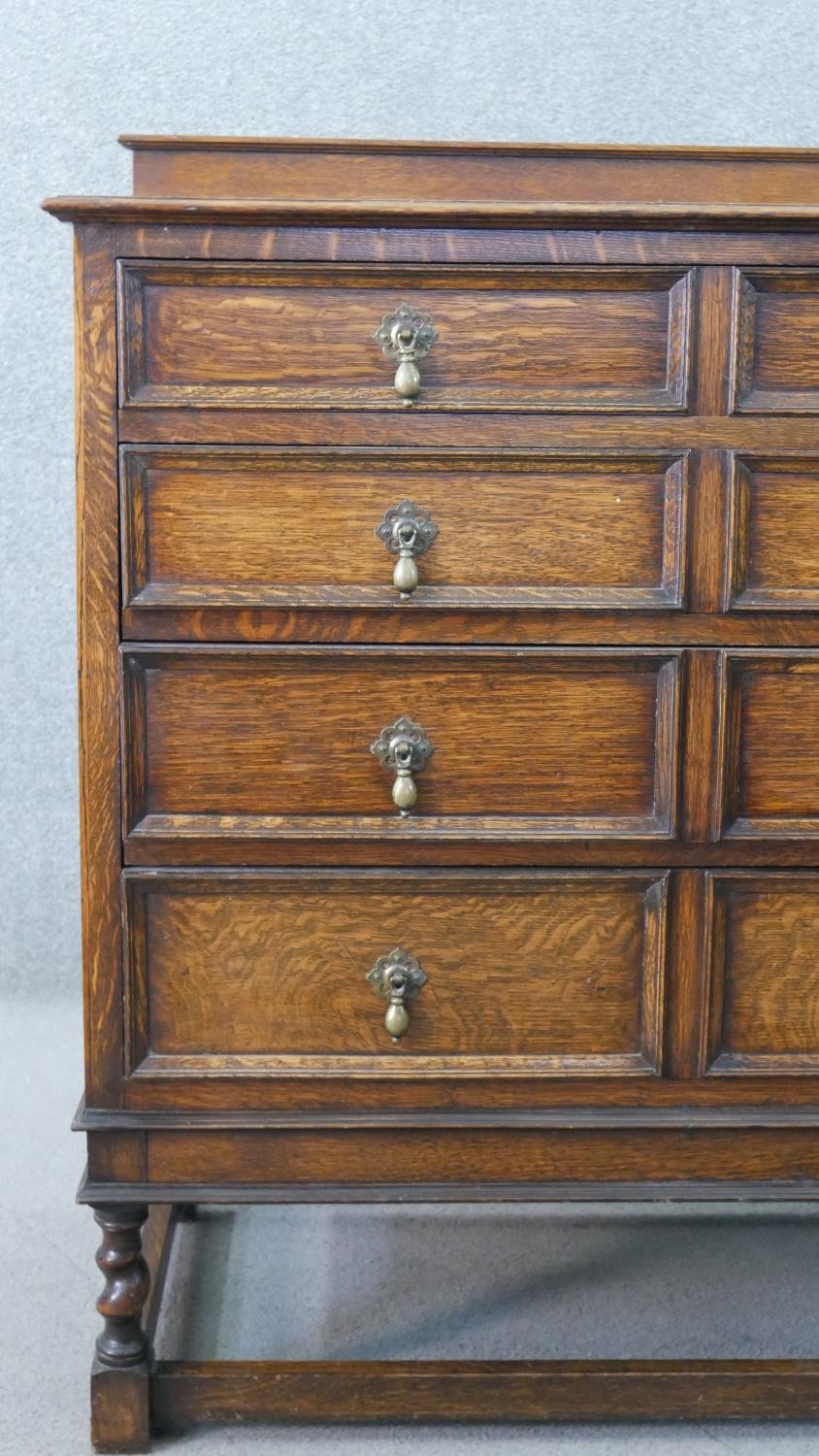 An early 20th century antique style oak chest of drawers, with a gallery back over four long - Image 3 of 7