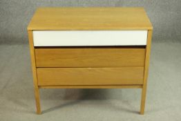 A mid 20th century oak chest of three long drawers, probably E Gomme, G-Plan, the top drawer
