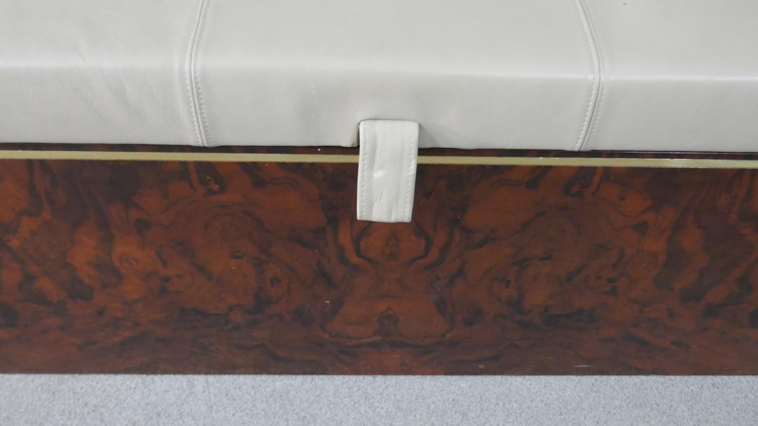 A figured walnut Ottoman, of slender rectangular form, with a white upholstered leather cushion lid, - Image 3 of 6