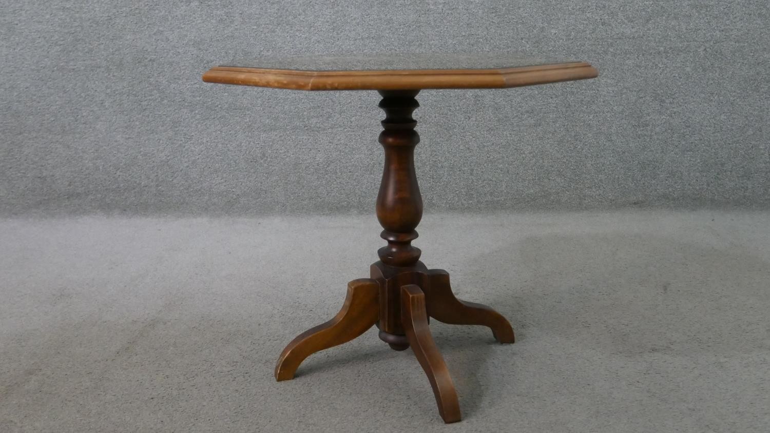 A 20th century octagonal occasional table, with a carved top, on a turned baluster stem, with four - Image 3 of 6