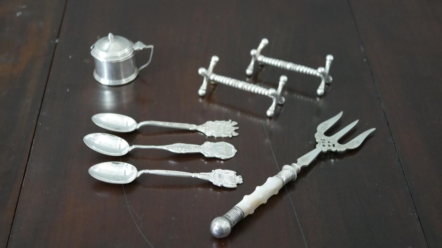 A collection of silver and silver plate, including a silver mustard pot (no liner), a pair of silver