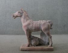 A large Tang style Chinese terracotta horse on a rectangular base. H.75 W.80 D.27cm