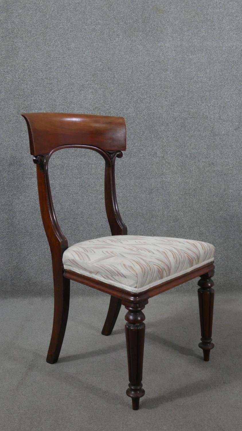 A set of six mahogany dining chairs, circa 1840, with bar backs, on carved reeded supports, over - Image 7 of 7