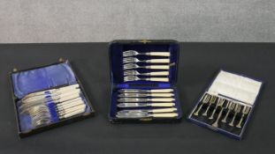 A collection of boxed silver plate cutlery, including pickle forks and two fish sets.