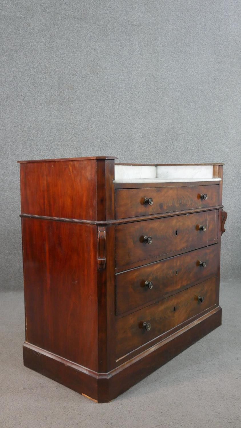 A Victorian flame mahogany dressing chest, with a white marble washstand top, over four long - Image 9 of 9