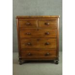 A Victorian walnut chest of two short over three long graduated drawers with knob handles, on turned