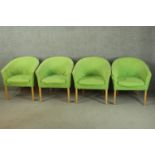 A set of four late 20th century tub chairs, upholstered in green fabric, on square section