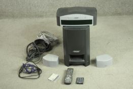 A Bose PS3-2-1 media centre with subwoofer, two speakers, cables and two remote controls. H.36 W.