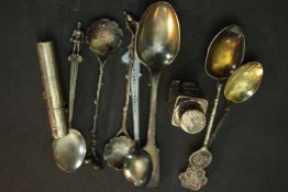 A collection of silver and white metal items, including two Chinese silver coffee spoons with