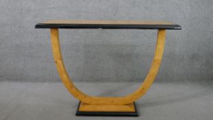 A contemporary Art Deco style console table, the rectangular top with a moulded ebonised edge, on