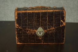 An alligator leather case of Masonic items, including regalia and medals. H.17 W.24 D.10cm.