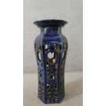 A 19th century Chinese style blue glaze ceramic lattice work jardinière stand. H.87 Diam.39cm