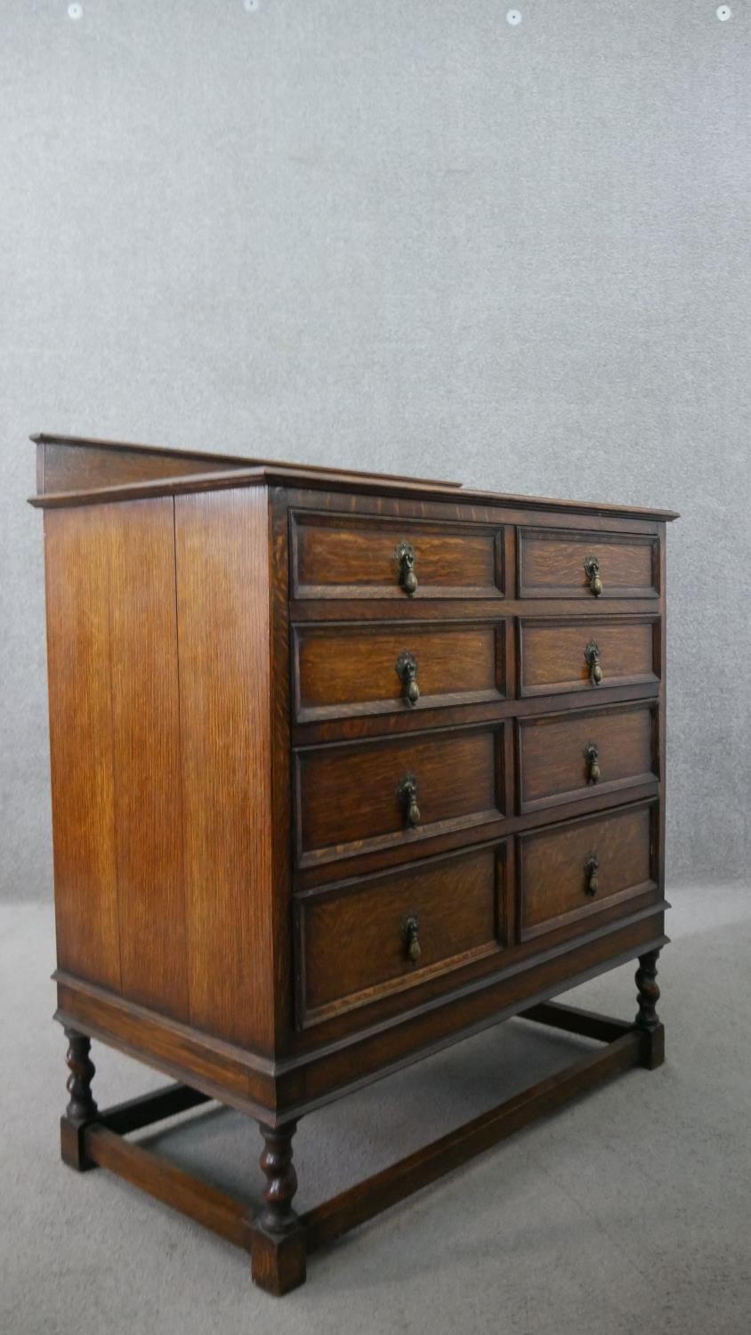 An early 20th century antique style oak chest of drawers, with a gallery back over four long - Image 7 of 7