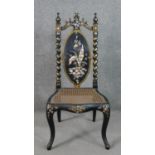 A Victorian black lacquered side chair, the oval back inlaid with mother of pearl to form a