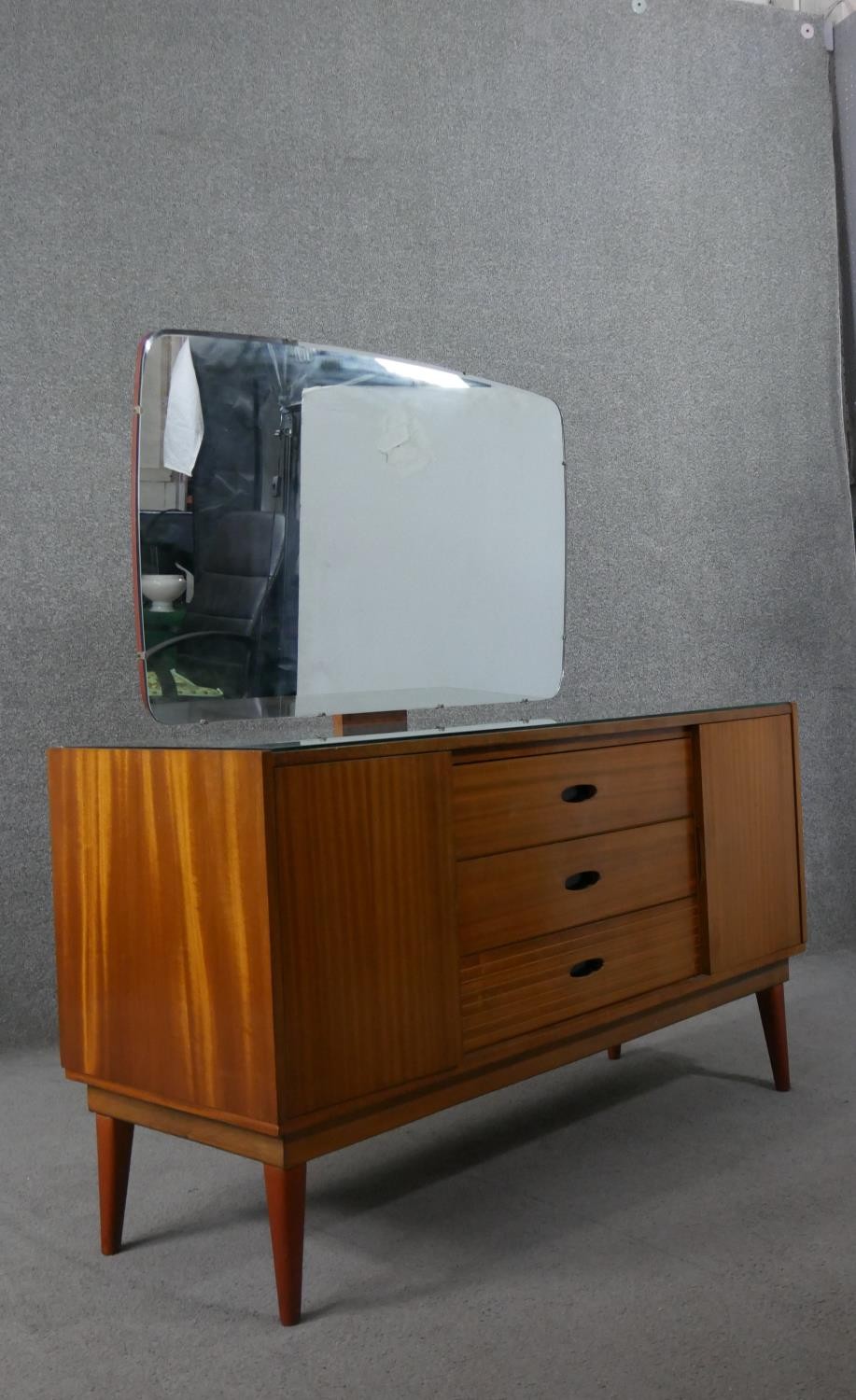 A circa 1960s teak dressing table, with a frameless mirror over three short drawers flanked by - Image 8 of 8