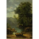 A gilt framed 19th century oil on board of a lake scene with mountains in the background.