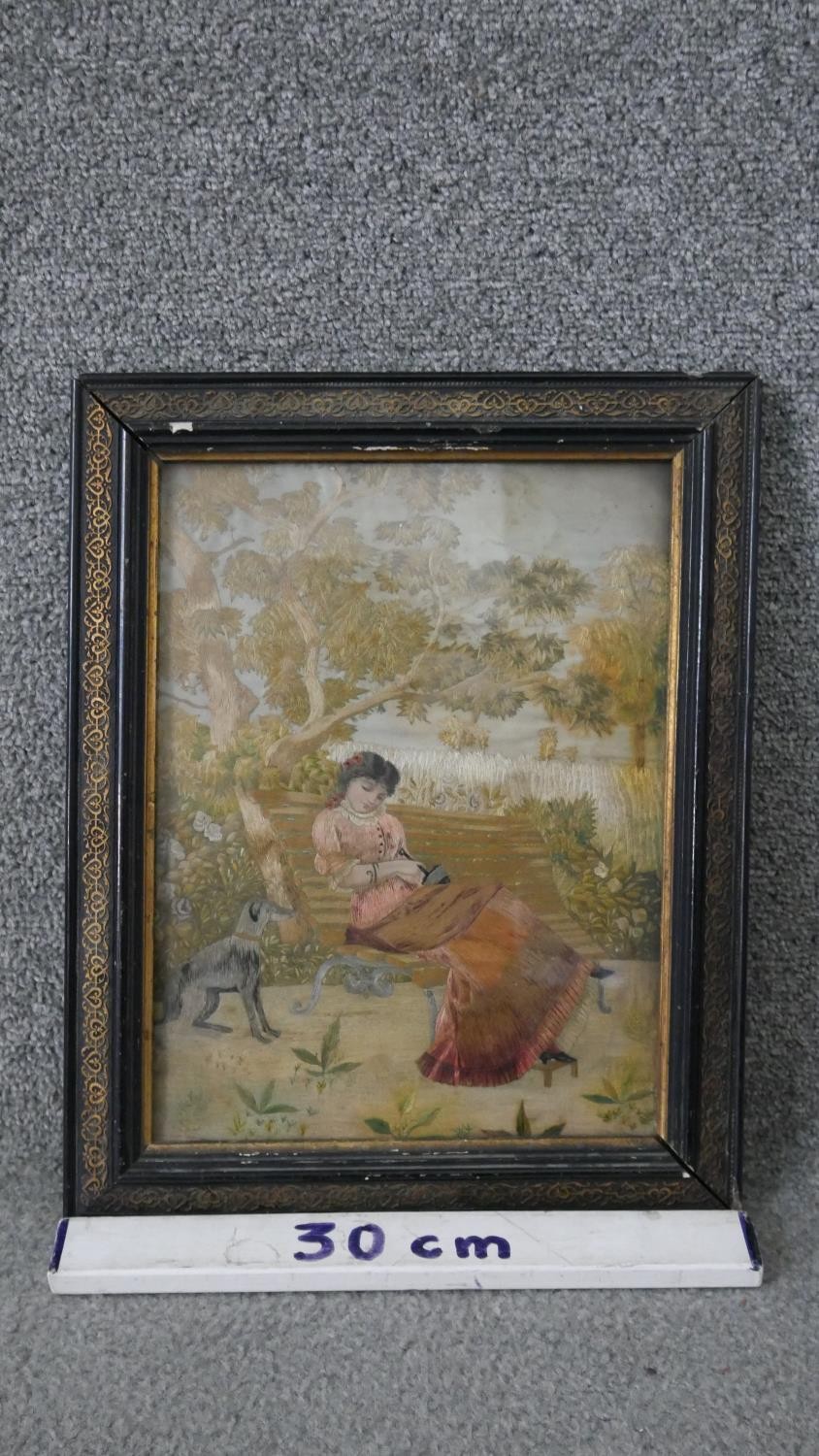 A framed and glazed 19th century Italian silk work embroidery of a lady sitting on a bench with - Image 3 of 4