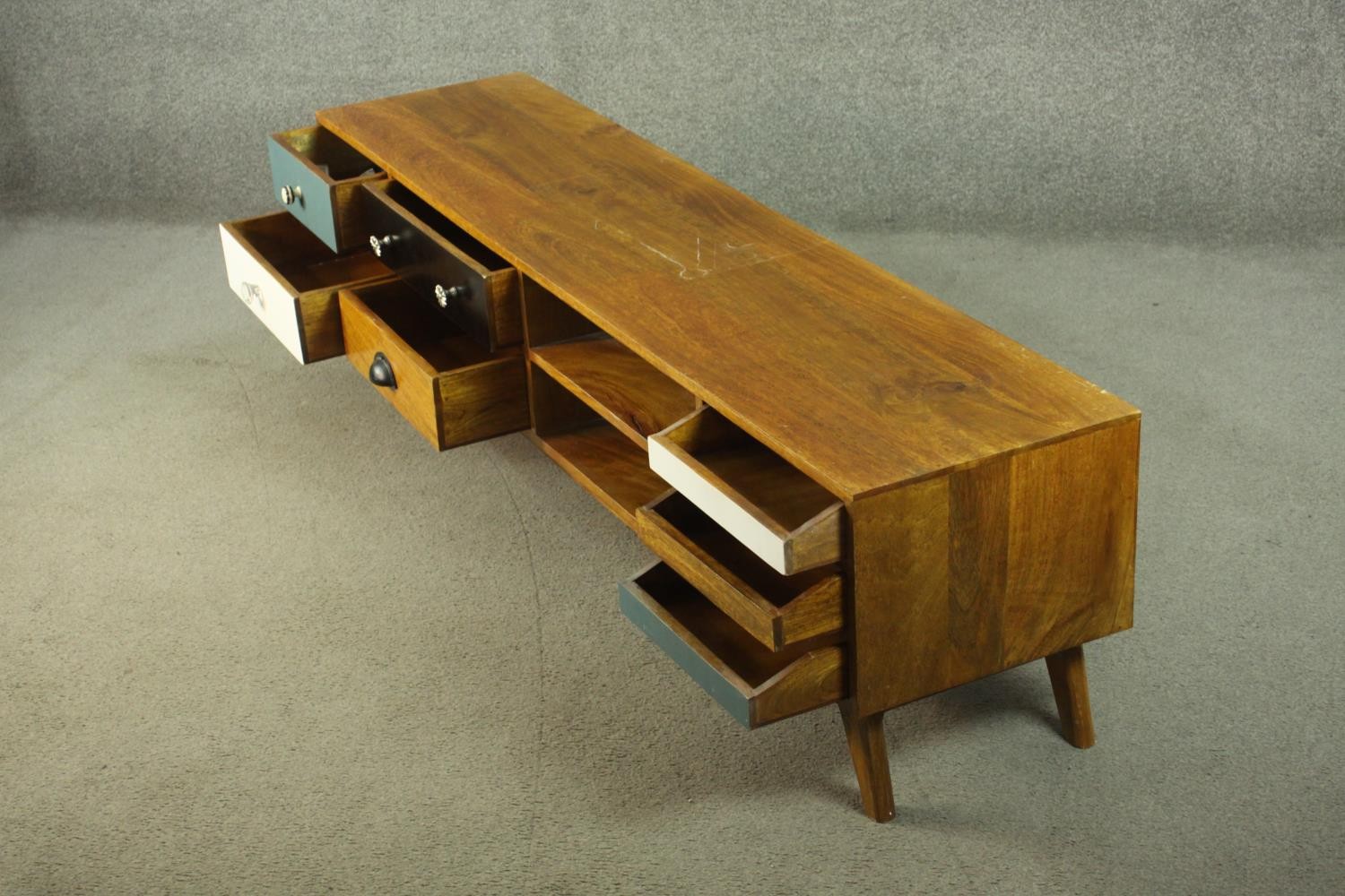 A contemporary mango wood sideboard or media cabinet, with an arrangement of seven drawers, some - Image 9 of 12