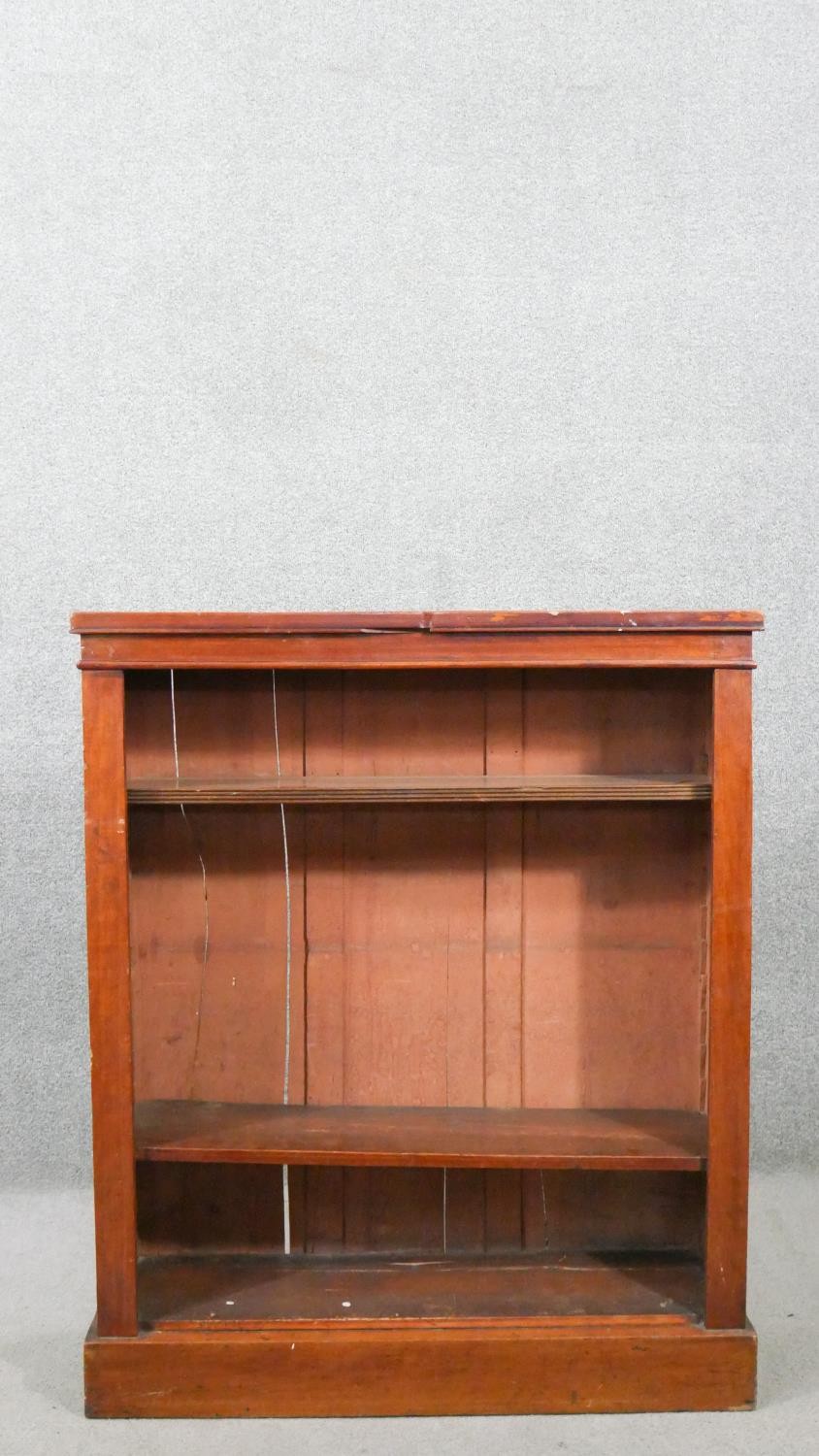 A Victorian walnut open bookcase, with adjustable shelving, on a plinth base. H.103 W.86 D.27cm