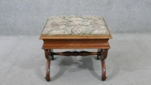 A Victorian walnut piano stool, the rising lid upholstered in machine made tapestry, on curved X