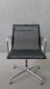 Charles and Ray Eames for Vitra, a Model EA107 or EA108 desk chair with black mesh back and seat,