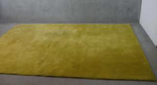 A contemporary John Lewis pure wool Wellington carpet, hand made in India, citrine hue, with
