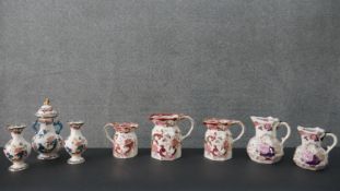 A collection of Mason's Ironstone ware, including various sizes of jugs and a twin handled lidded