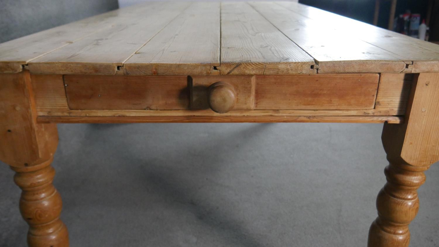 A Victorian pine planked top kitchen table, with an end drawer, on turned legs. H.75 W.186 D.97cm - Image 2 of 6