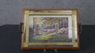 An Art Deco mirrored tray with carved floral border, mirrored yellow glass block work and a transfer