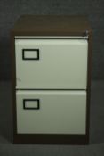 A late 20th century office filing cabinet, with a brown powder coated body and two cream drawers.