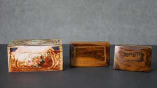 A tin plate vintage biscuit tin with classical figural design along with two olivewood boxes