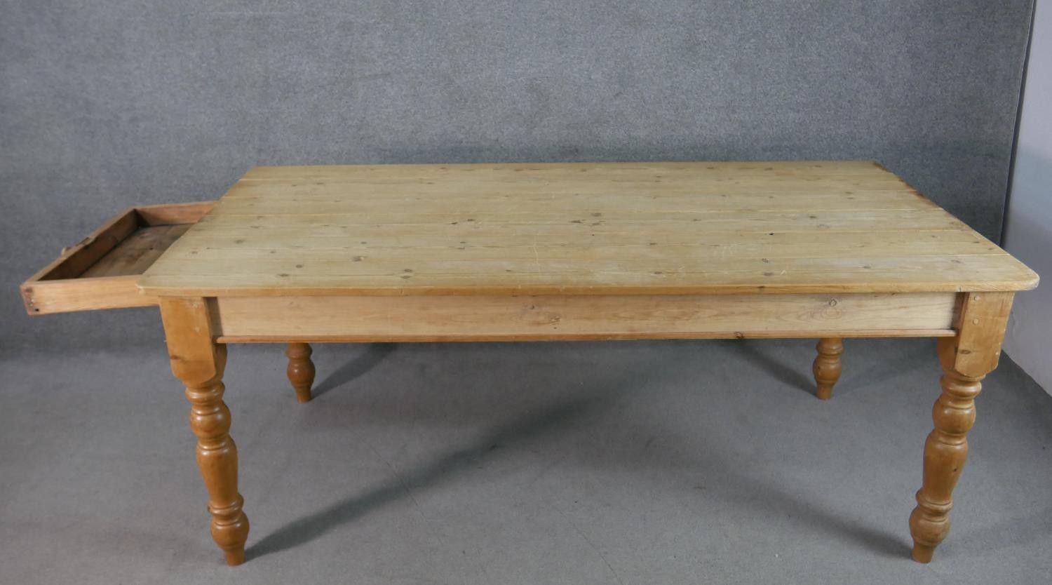 A Victorian pine planked top kitchen table, with an end drawer, on turned legs. H.75 W.186 D.97cm - Image 4 of 6