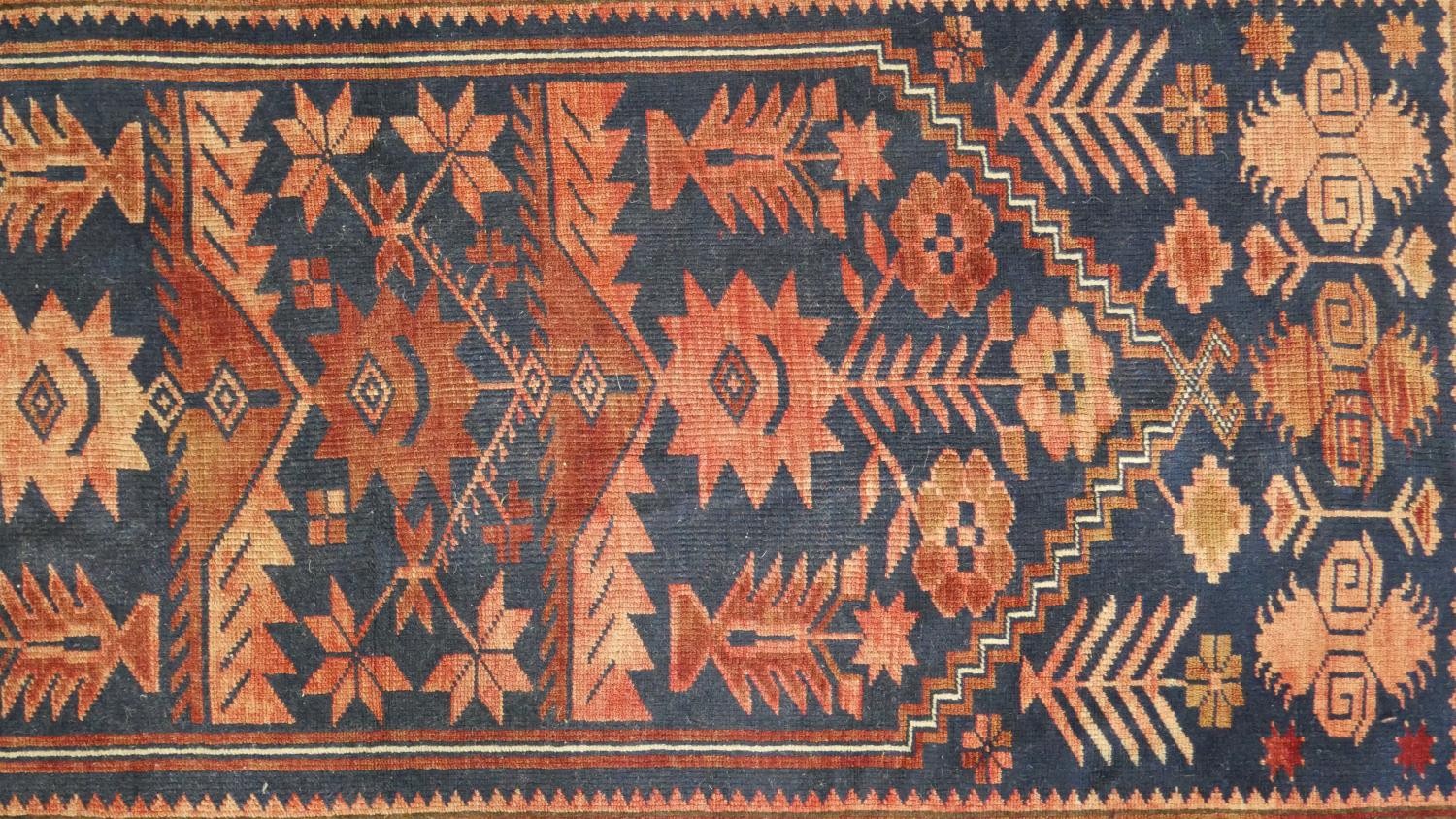 A handmade Turkish Yagcibedir rug, on a blue ground. L.108 W.118cm. - Image 4 of 7