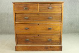 A late Victorian walnut chest of two short over three long drawers, on a plinth base. H.113 W.110