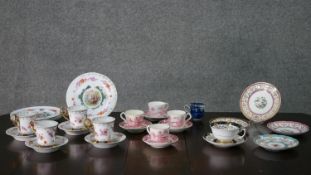 A collection of early 20th century hand painted and transfer printed fine china cups and saucers,
