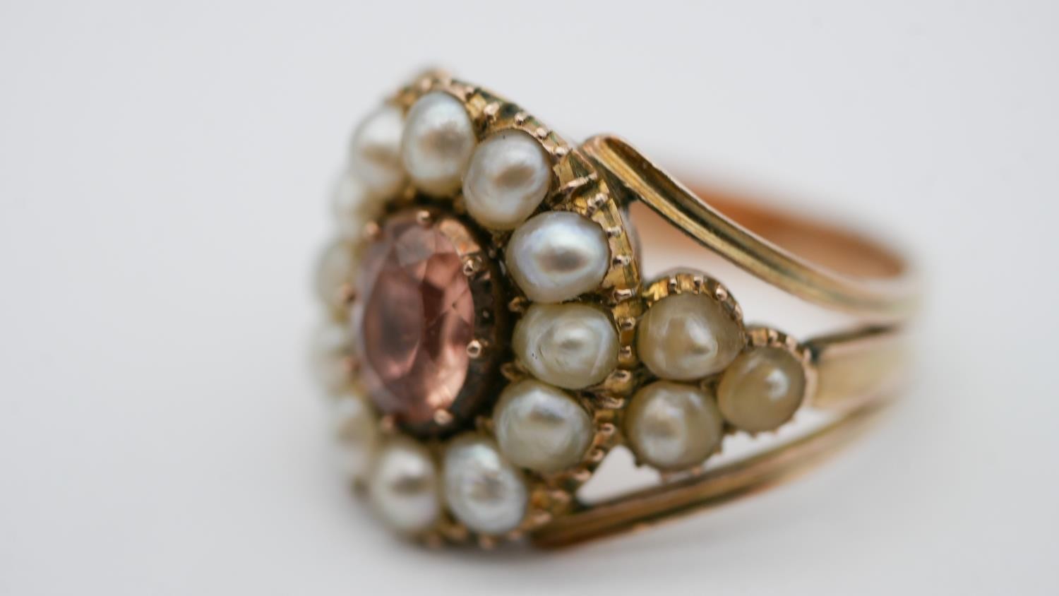 A Georgian pearl and topaz yellow metal cluster ring. Set to centre with an oval foil backed peach - Image 5 of 7