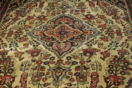 A Persian Hamadan cream ground hand made carpet. L.280 W.230cm.