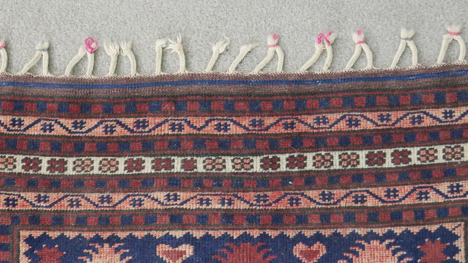 A handmade Turkish Yagcibedir rug, on a blue ground. L.108 W.118cm. - Image 6 of 7