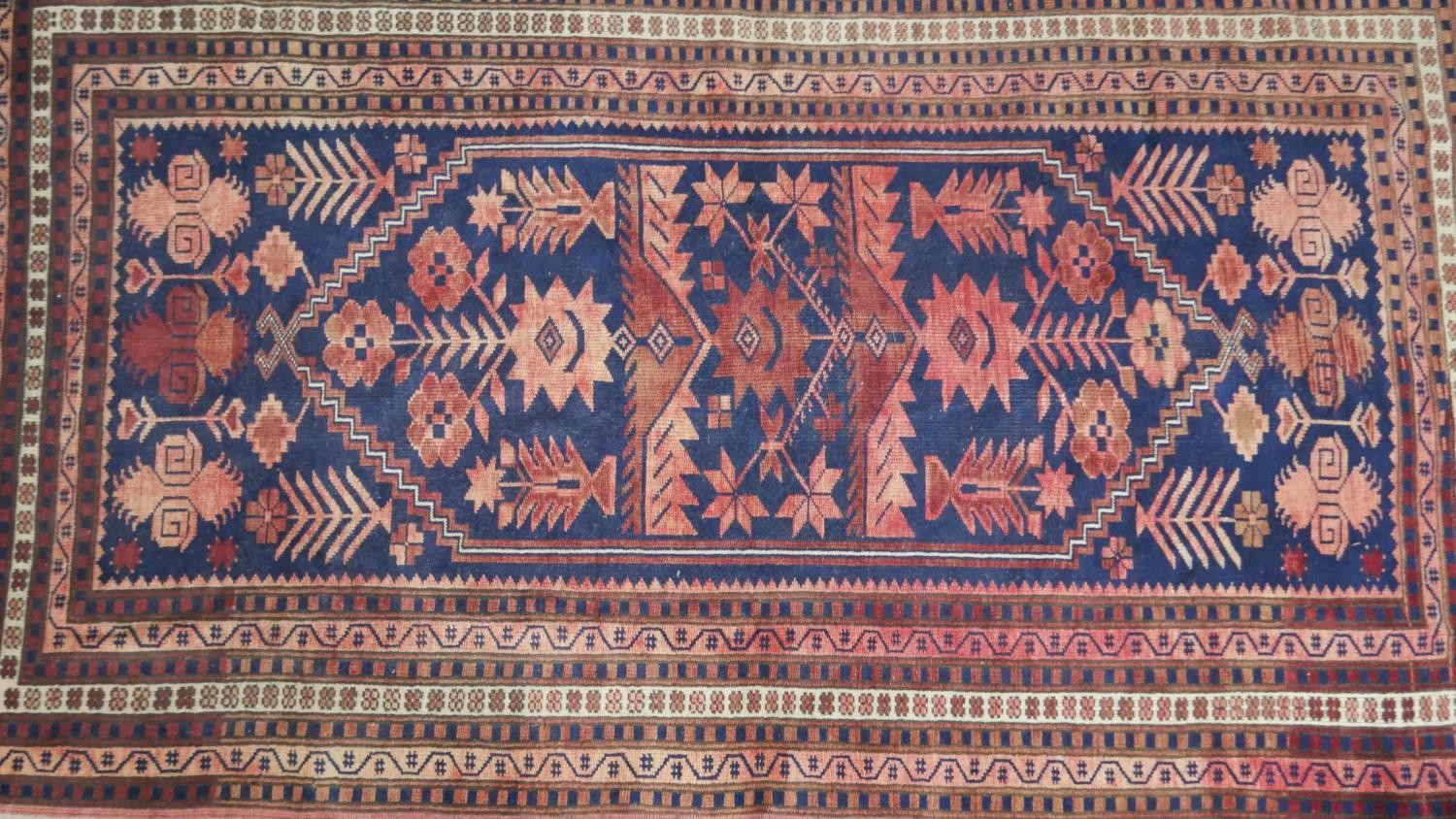 A handmade Turkish Yagcibedir rug, on a blue ground. L.108 W.118cm. - Image 3 of 7